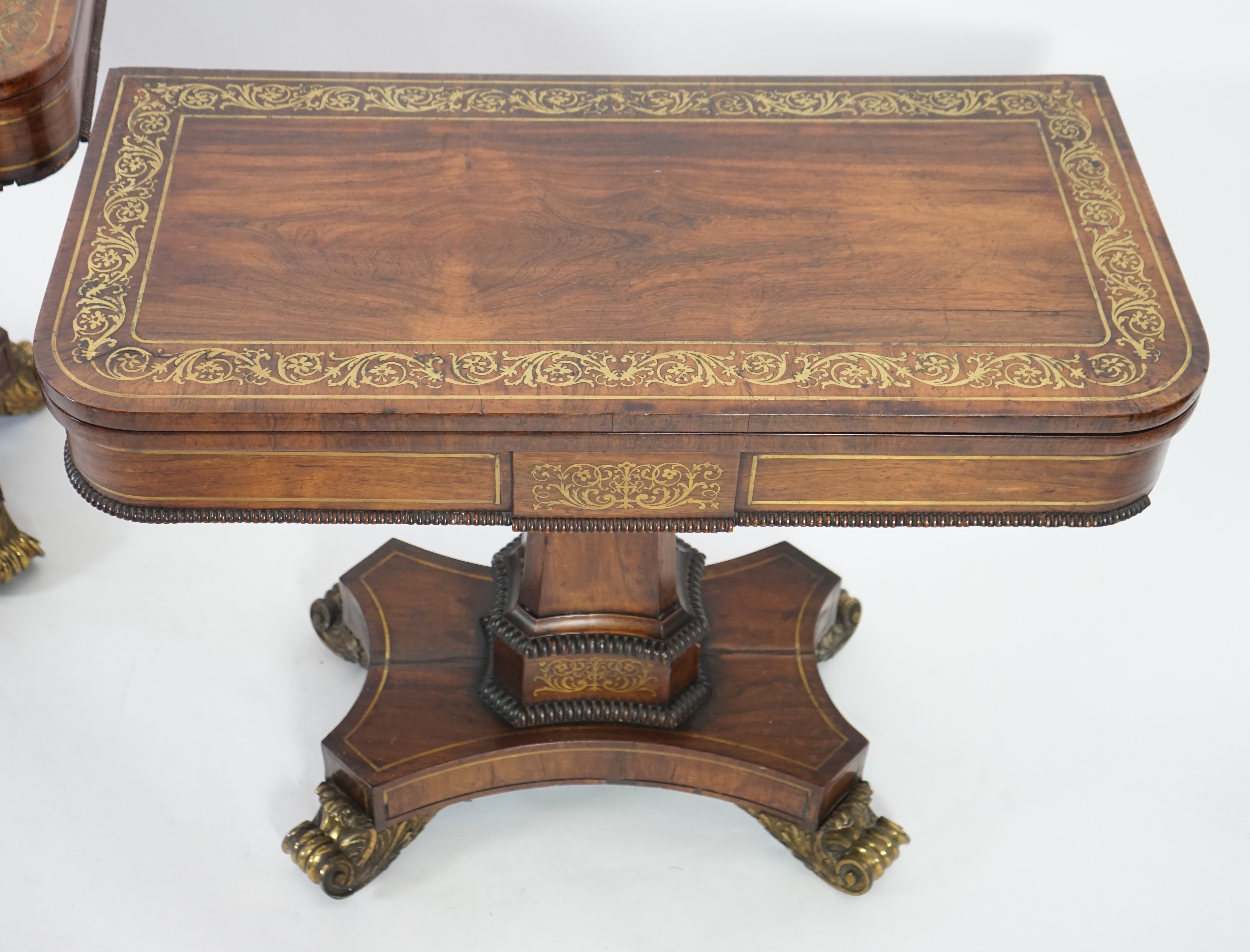 A pair of Regency brass inset rosewood card tables